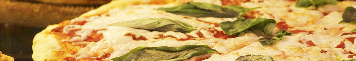 Eating Italian Pizza at K's Italian Prosciutto's Pizza restaurant in Londonderry, NH.